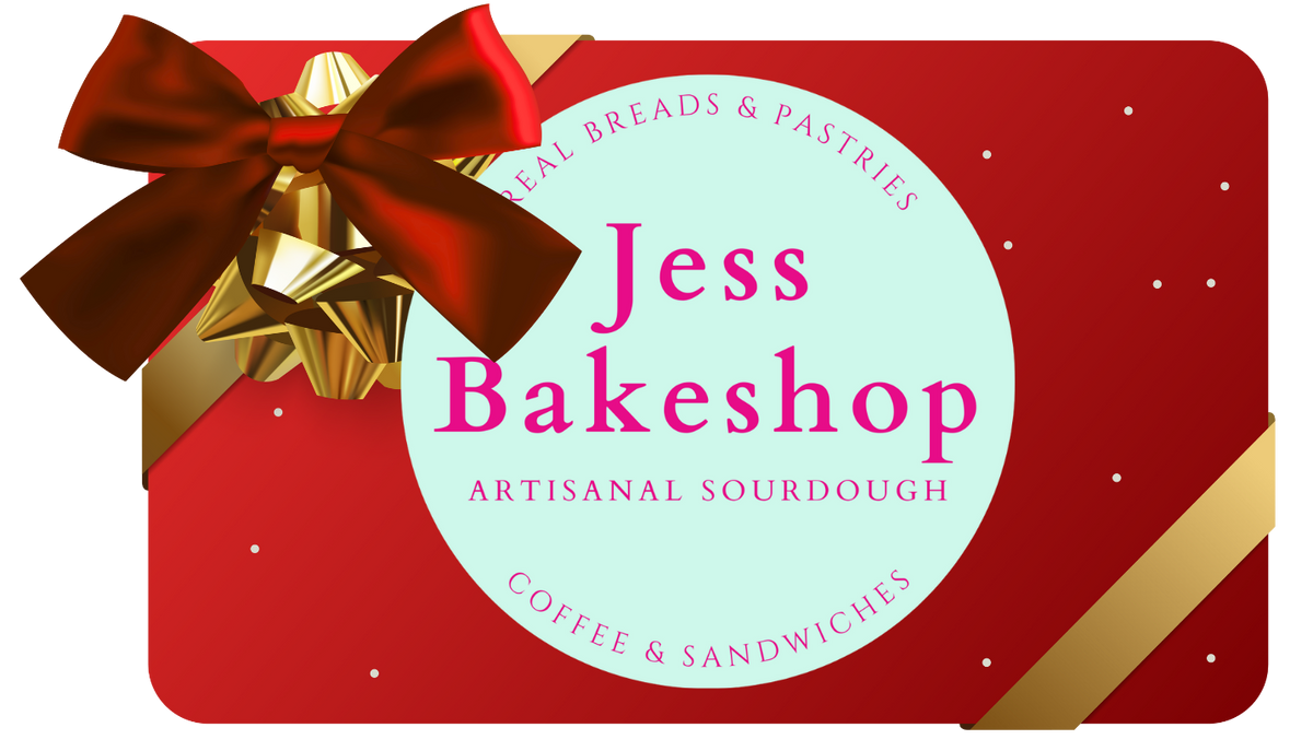 Red gift box with a bow featuring 'Jess Bakeshop' branding.