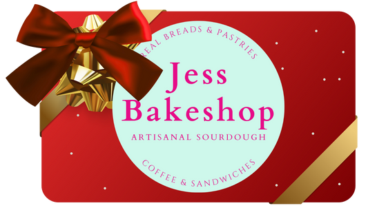 Red gift box with a bow featuring 'Jess Bakeshop' branding.