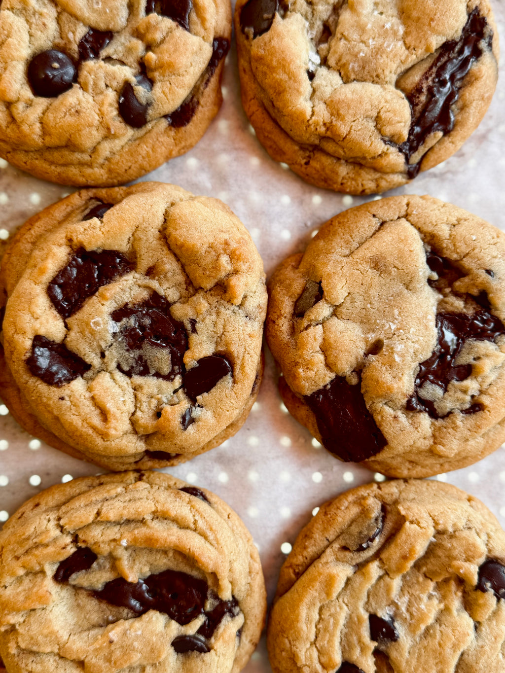 Chocolate chip cookies on a polka dot surface